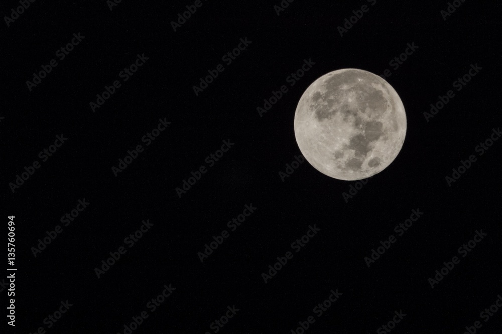Fototapeta premium Blur moon with isolated black sky background for text adding