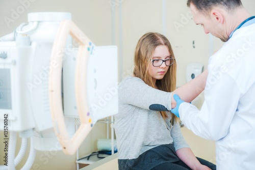 Doctor Examining Broken Arm