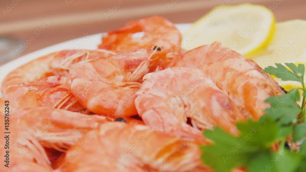 Close-up of shrimp on a white plate with lemon and parsley Close-up of shrimp on a white plate with lemon and parsley