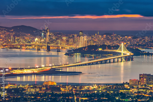 San Francisco skyline and Bay Bridge at sunset photo