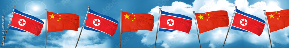 North Korea flag with China flag, 3D rendering North Korea flag with China flag, 3D rendering
