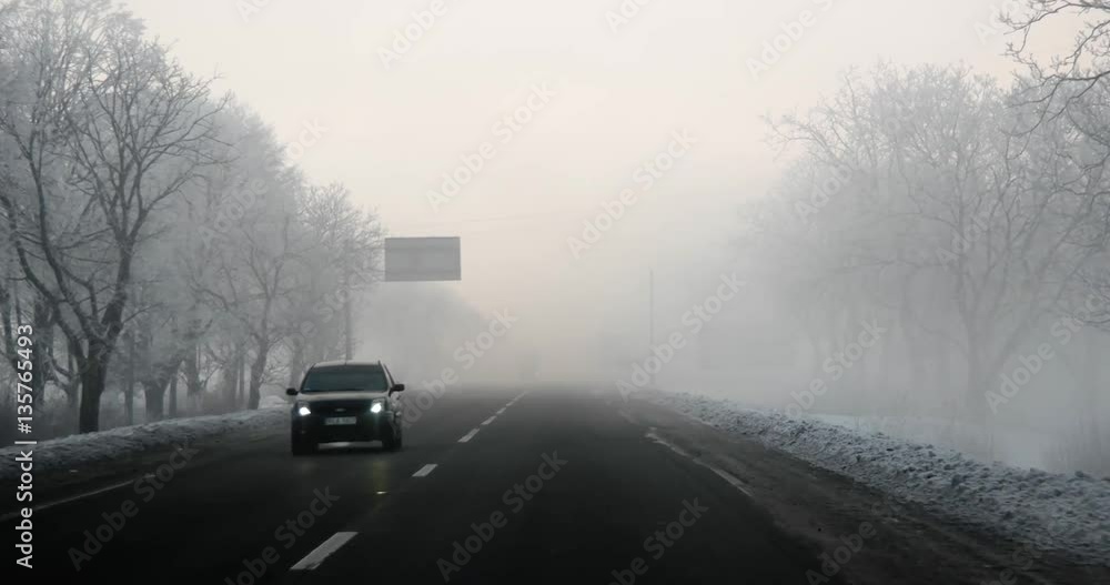 Driving Car Point of View on Winter Morning Foggy Road With Sun at the Sky Car Front Window Windscreen View in Early Morning Foggy Sunrise Wanderlust Driving Car Point of View on Winter Morning Foggy Road With Sun at the Sky Car Front Window Windscreen View in Early Morning Foggy Sunrise Wanderlust