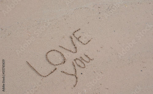 writing love on sand   © saylakham