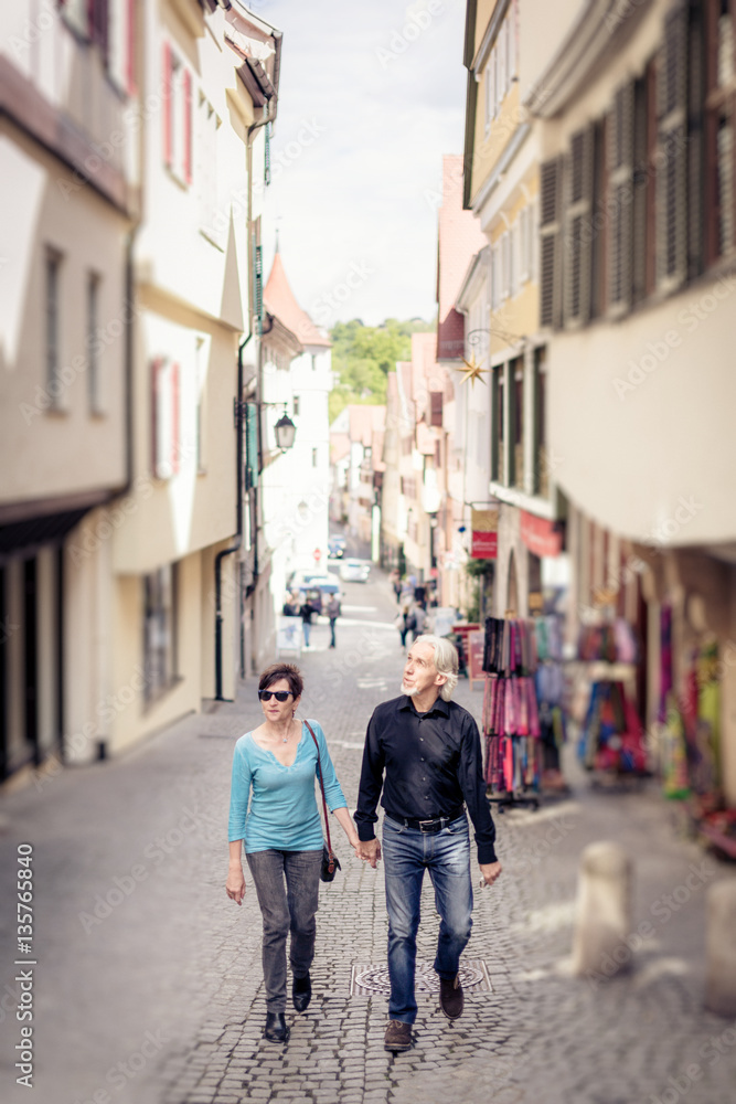 Senior Couple Walking Through The Streets Of Tuebingen