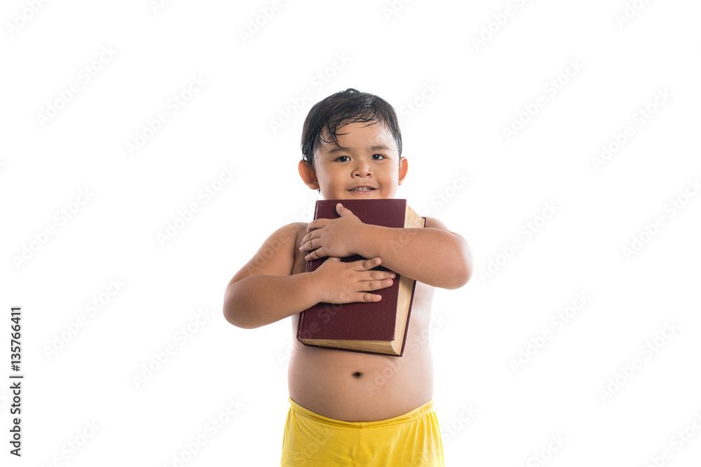 Funny Little boy is holding a book isolated on white background. Funny Little boy is holding a book isolated on white background.