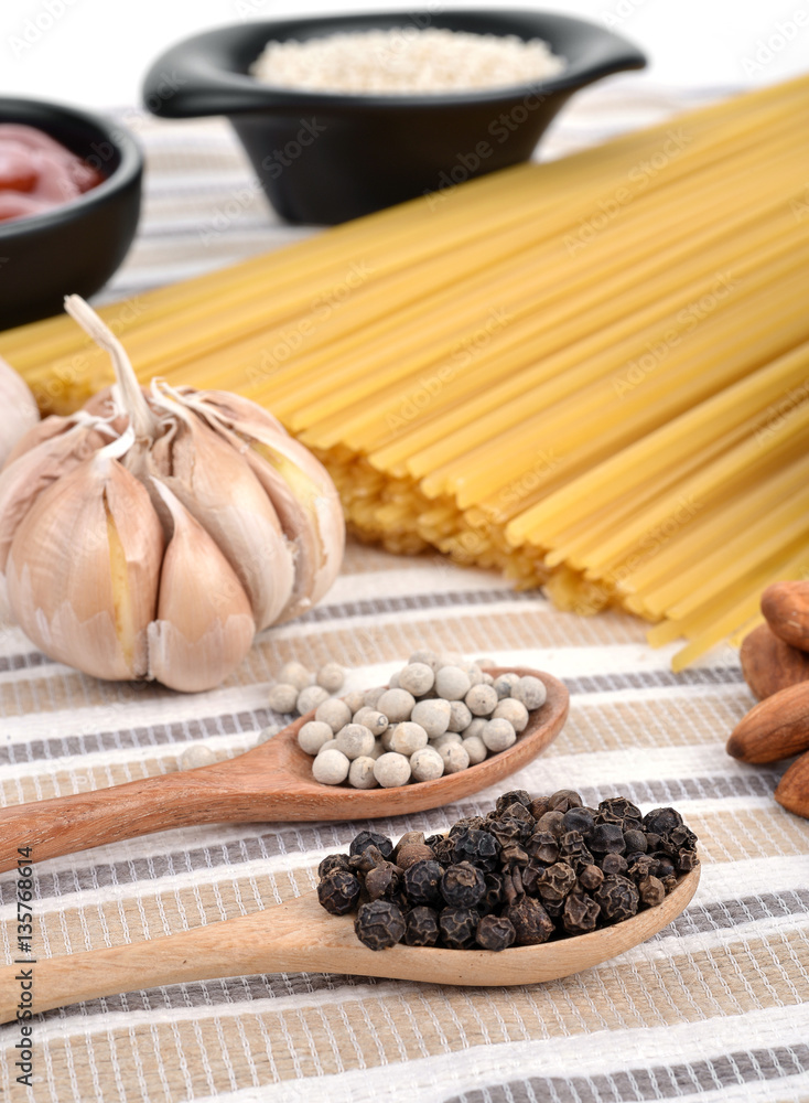 Pasta spaghetti with tomatoes ; pepper ,garlic background. Pasta spaghetti with tomatoes ; pepper ,garlic background.