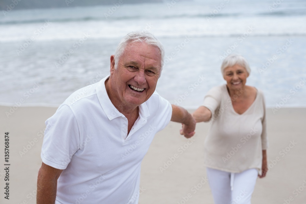 Senior couple having fun together at beach