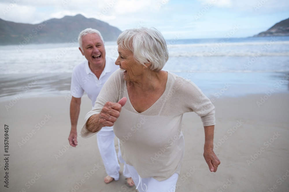 Senior couple having fun together at beach Senior couple having fun together at beach