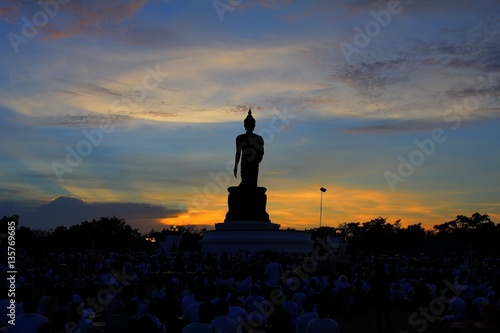 Makha Bucha Day, Unidentified thai people holding lit candle and walk around Big Buddha for Worship on the Holiday at Phutamonthon Park Thailand.