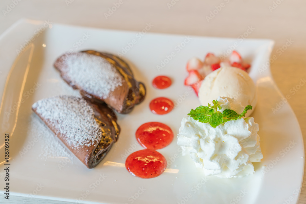 Pancake and fruit with ice cream on table . Pancake and fruit with ice cream on table .