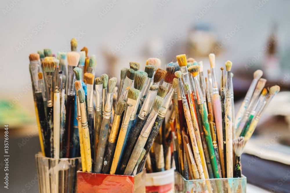 Fototapeta premium a lot Paint Brushes isolated in blur background, close-up