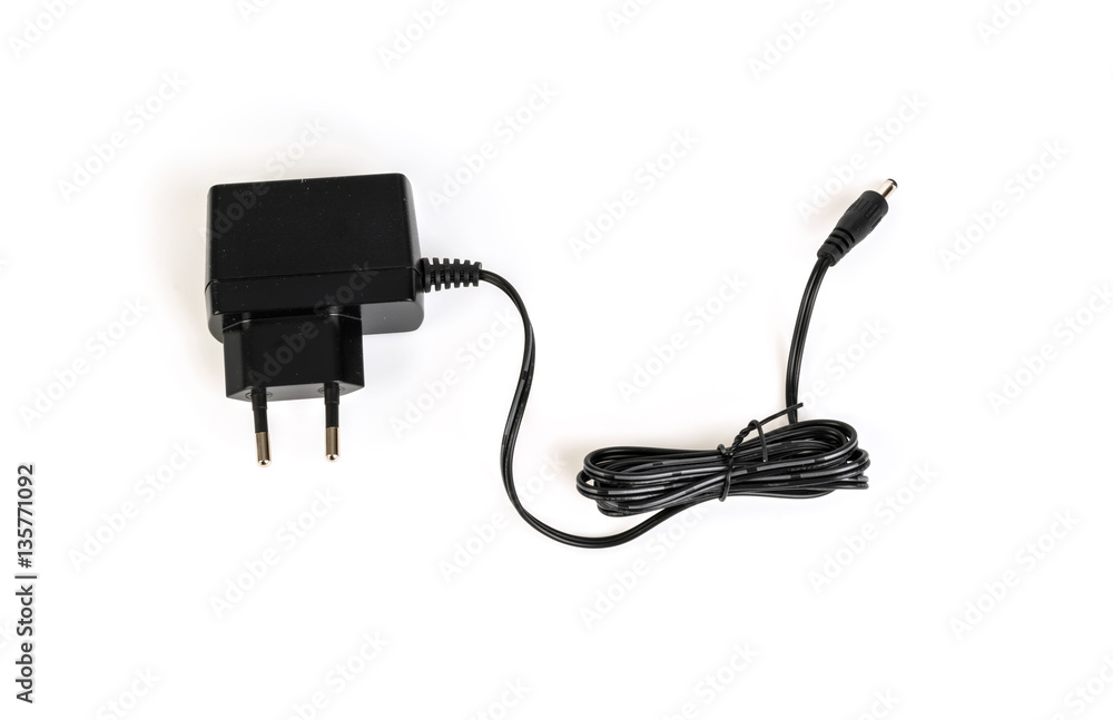 AC adapter on a white background . AC adapter on a white background .