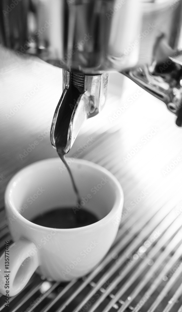 Barista making a cup of coffee soft focus image . Barista making a cup of coffee soft focus image .