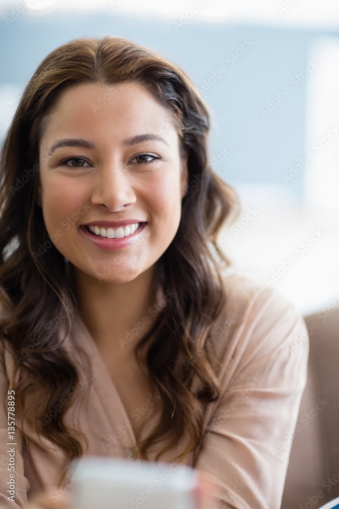 Portrait of smiling woman in living room Portrait of smiling woman in living room