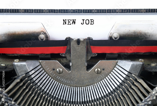 NEW JOB typed words on a Vintage Typewriter Conceptual