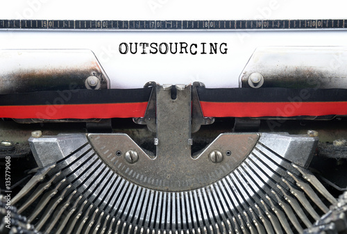 OUTSOURCING typed words on a Vintage Typewriter Conceptual