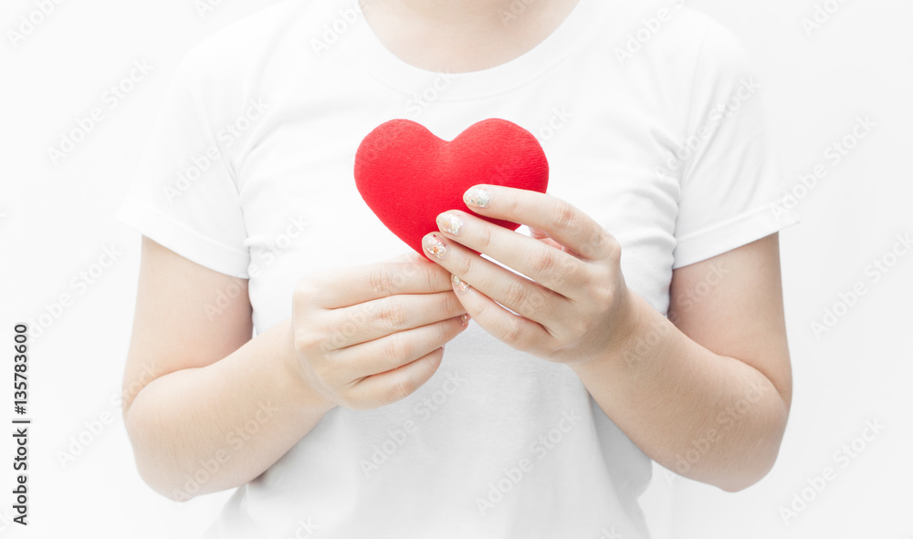 Woman holding and protecting a red heart shape on white background close-up,Symbol of love or dating Valentines day Woman holding and protecting a red heart shape on white background close-up,Symbol of love or dating Valentines day