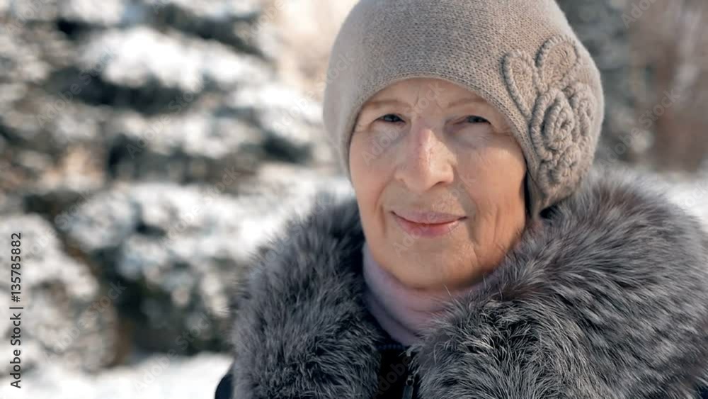 beautiful aged woman on the street, winter time, slow motion beautiful aged woman on the street, winter time, slow motion