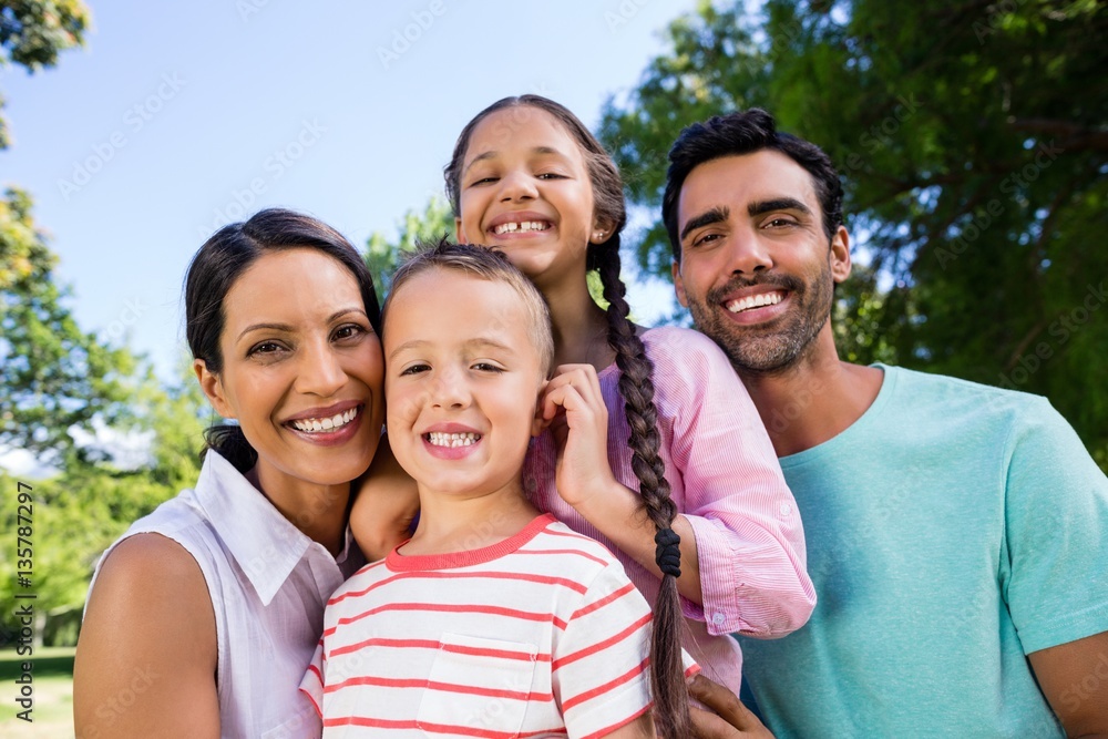 Obraz premium Portrait of happy family in park