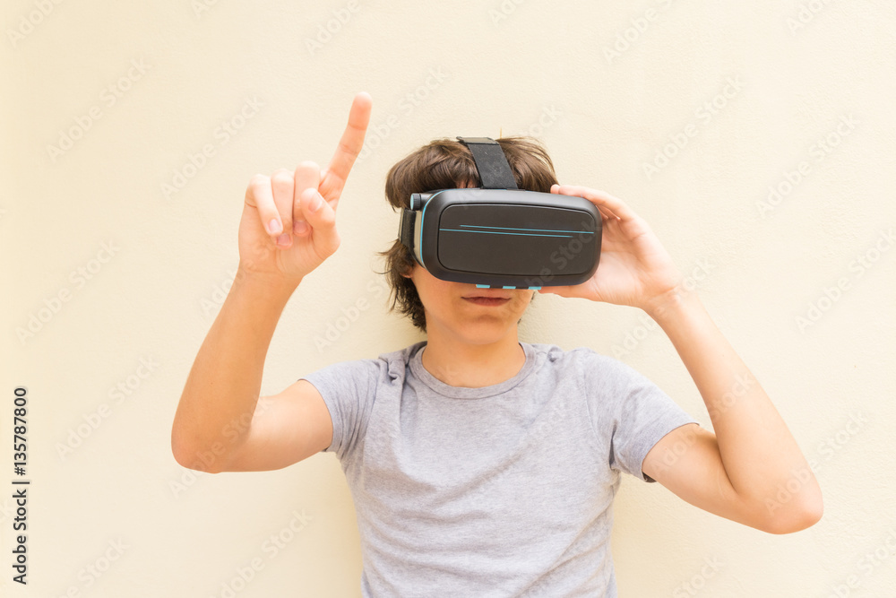 Teenager wearing and touching something in VR virtual realty glasses Teenager wearing and touching something in VR virtual realty glasses