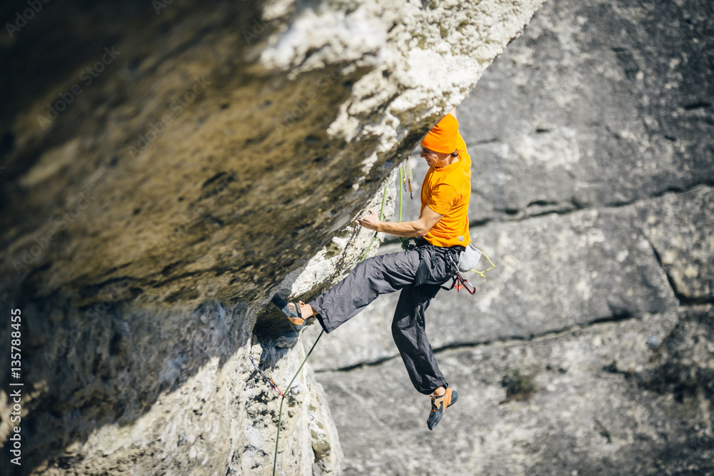 men climbs a rock men climbs a rock