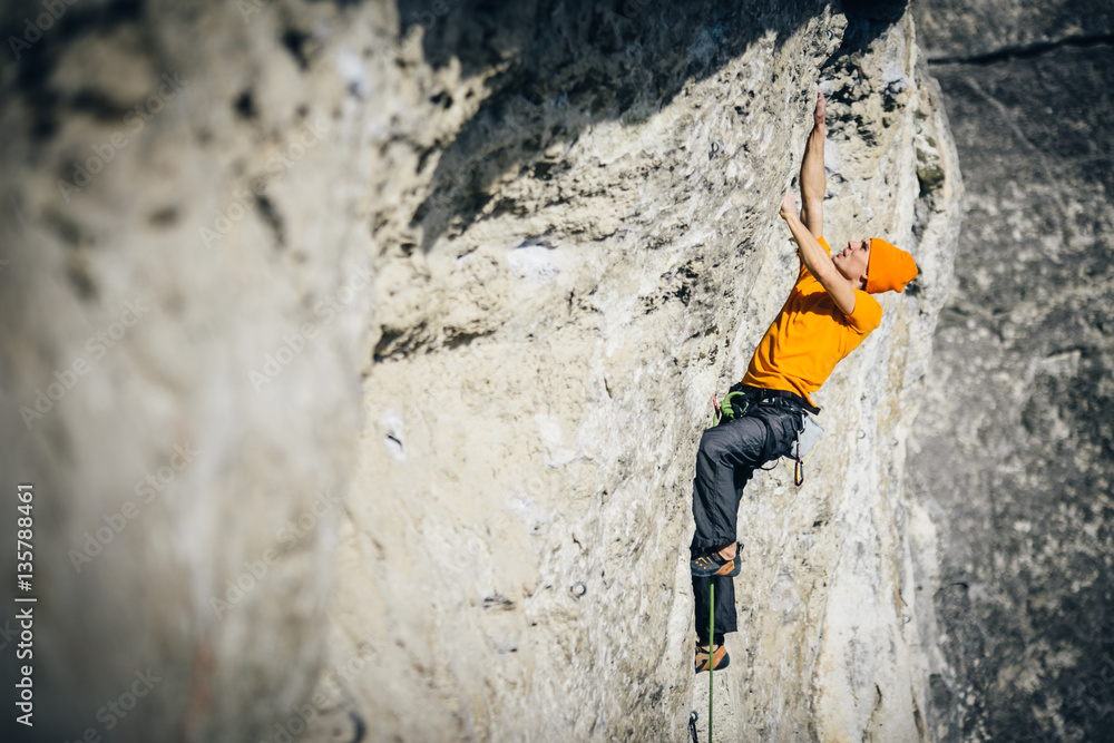 men climbs a rock men climbs a rock