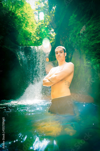 Young Man By The Waterfall