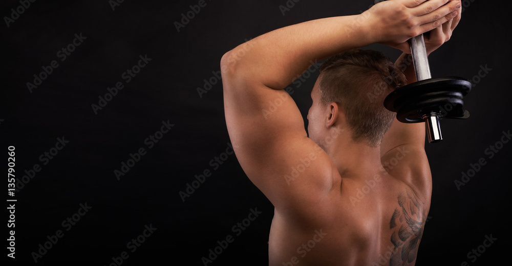 Strong man makin exercises on triceps. muscular body with free space for fitness goods. Close up shot training hands. Two-Arms Triceps Extension Strong man makin exercises on triceps. muscular body with free space for fitness goods. Close up shot training hands. Two-Arms Triceps Extension