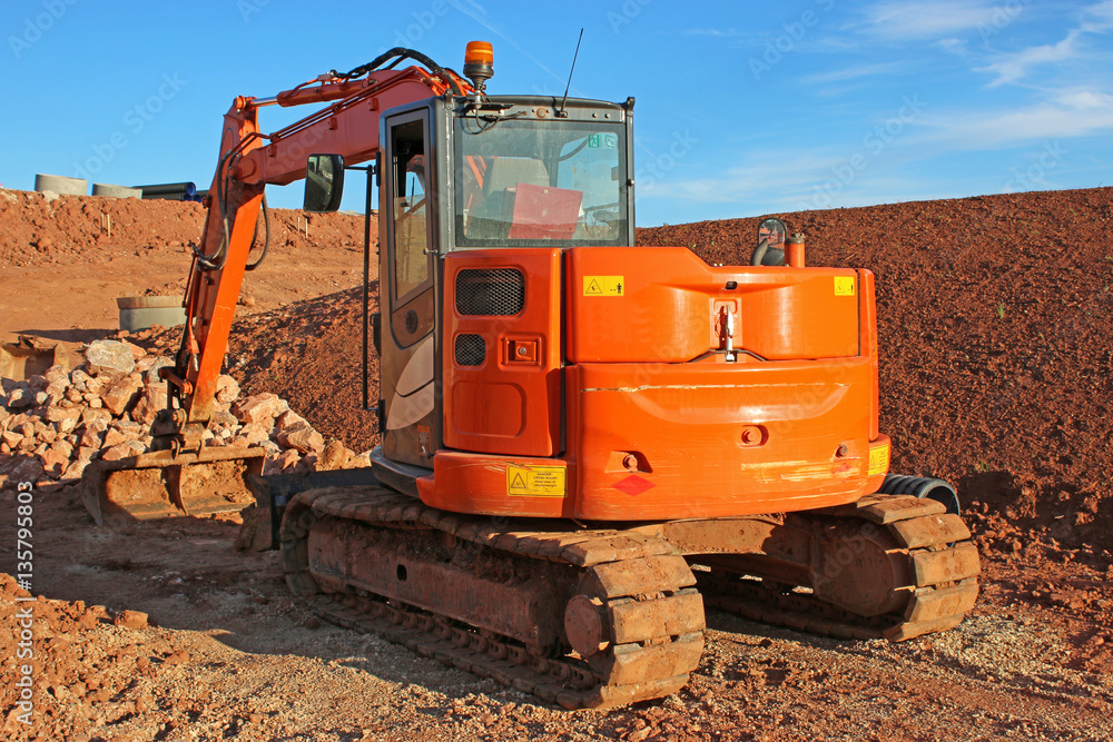 Digger on a construction site Digger on a construction site