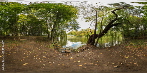 Full 360 degree equirectangula panorama in the park by the lake