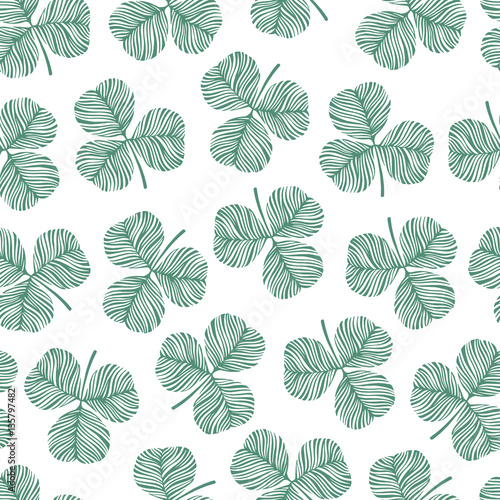 Trendy monochrome seamless pattern with clover leaves. © Olga Skorobogatova