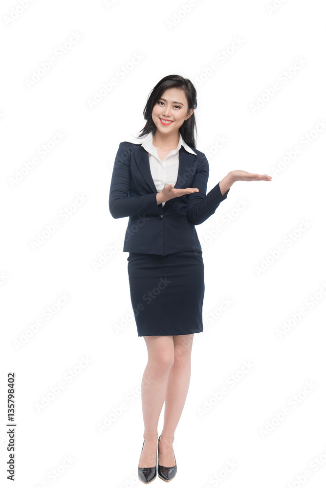 Full body of an attractive young businesswoman showing by hands Full body of an attractive young businesswoman showing by hands