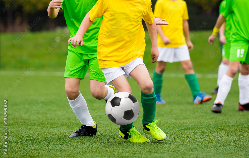 Running Football Soccer Players with Ball. Footballers Kicking Football Match on the Pitch. Young Teen Soccer Game. Youth Sport Background