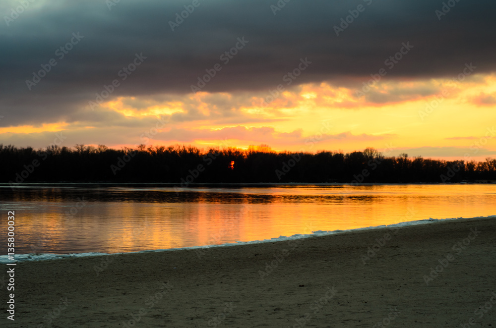 Beautiful winter sunset on river Dnieper