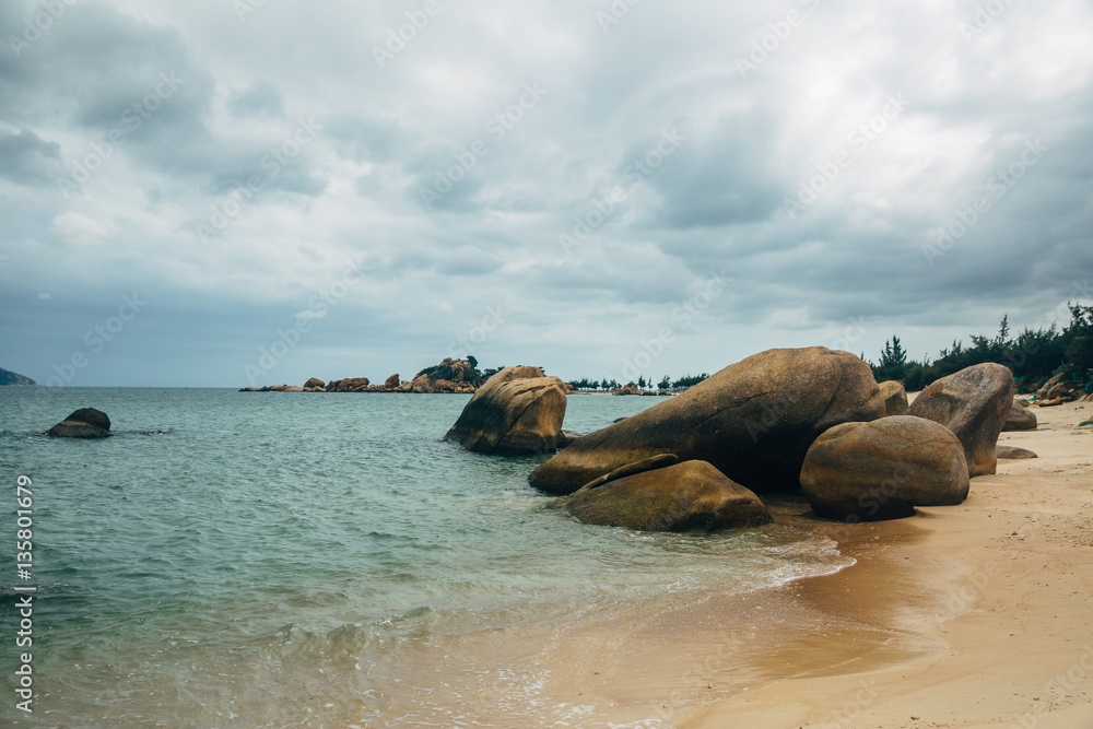 Beautiful landscape with view of ocean, perfect beach, big stones, trees, azure water. Background image. Concept travel Beautiful landscape with view of ocean, perfect beach, big stones, trees, azure water. Background image. Concept travel