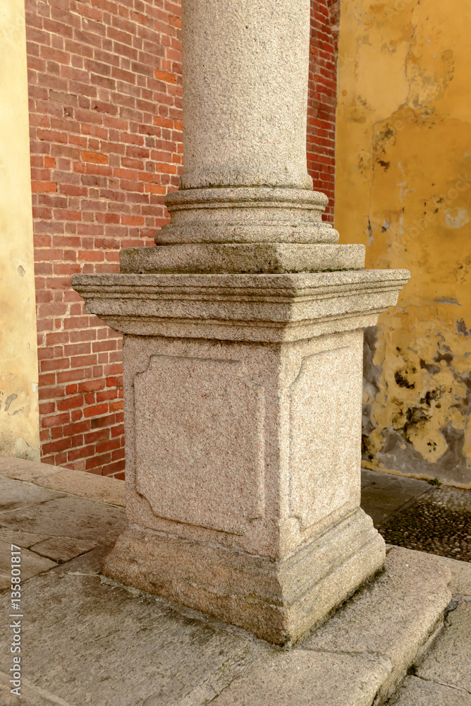 column plinth of church facade at Morimondo abbey, Milan, Italy