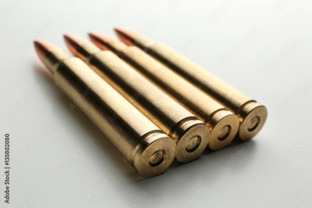 Rifle bullets on white background Rifle bullets on white background
