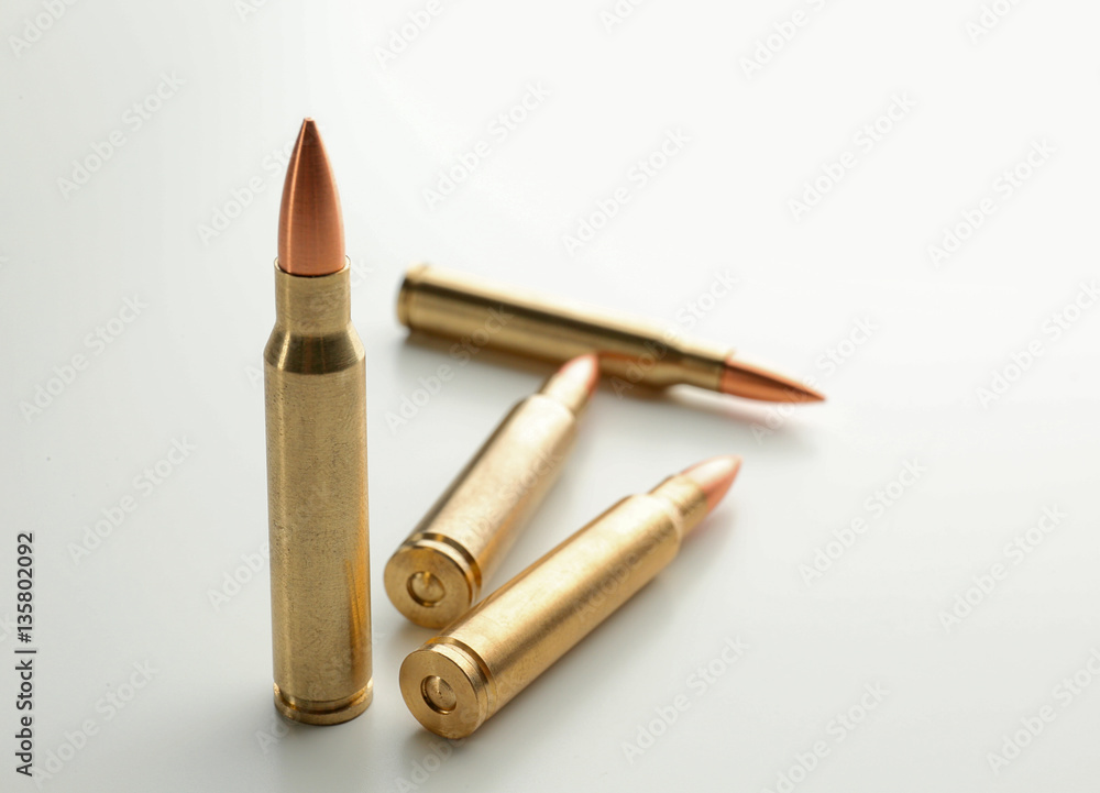 Rifle bullets on white background Rifle bullets on white background