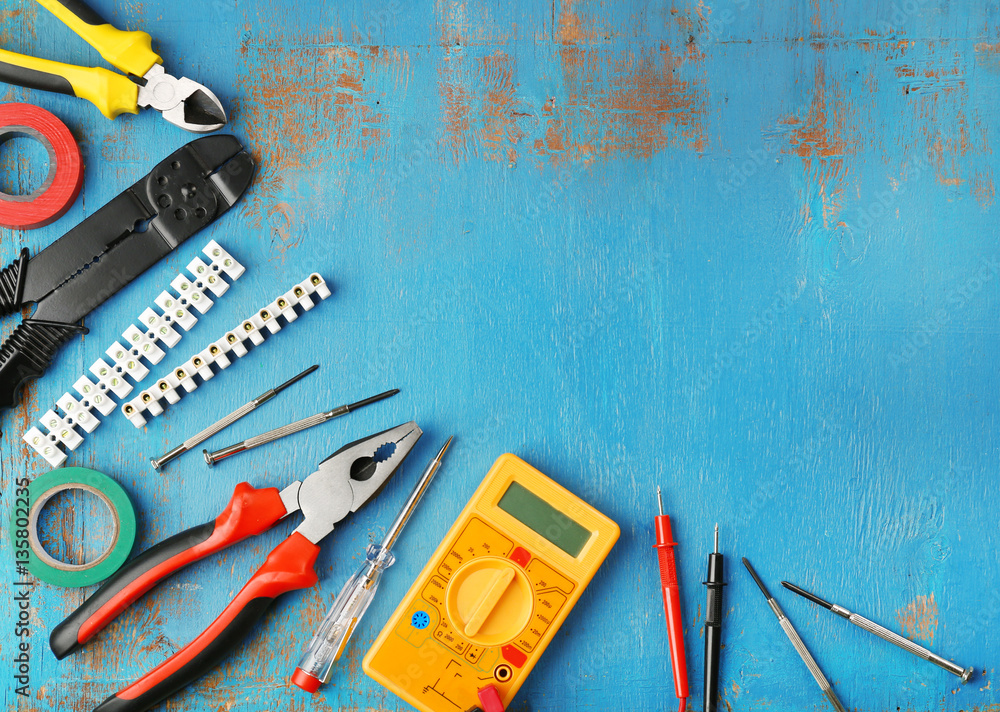 Different electrical tools on wooden table Stock Photo | Adobe Stock