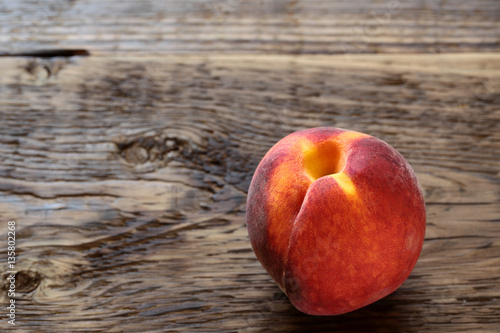 ripe peach on a wooden