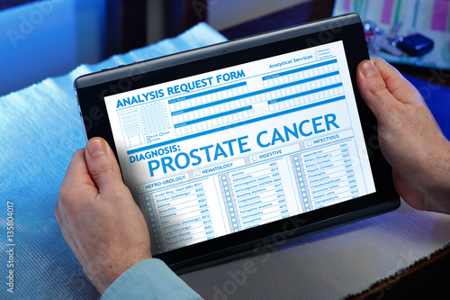 Patient with a prostate cancer diagnosis in his digital medical / Man consulting on the tablet his medical report on the internet 