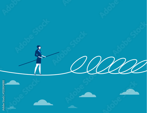 Businesswoman walking a tightrope and barrier