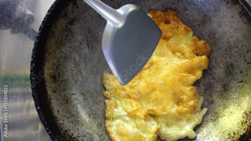 Cooking omelet in hot pan with oil  photo