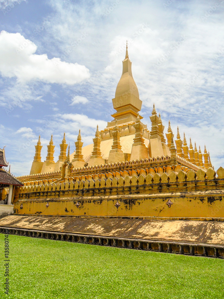 Naklejka premium That Luang is a gold-covered large Buddhist stupa in the center of Vientiane, Laos. 