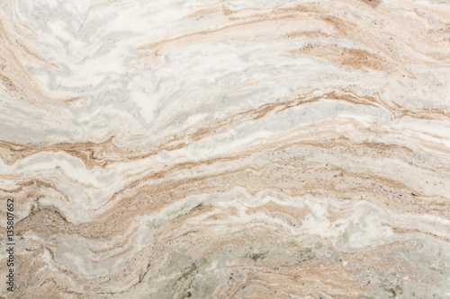 Light brown quartzite stone surface.