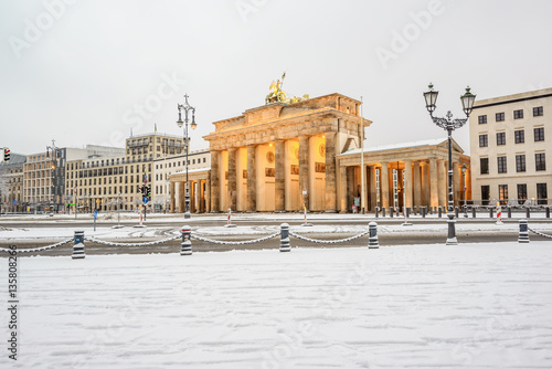 Canvas Print illuminated Brandenburg gate (Brandenburger Tor) and 18th of March Square in sno