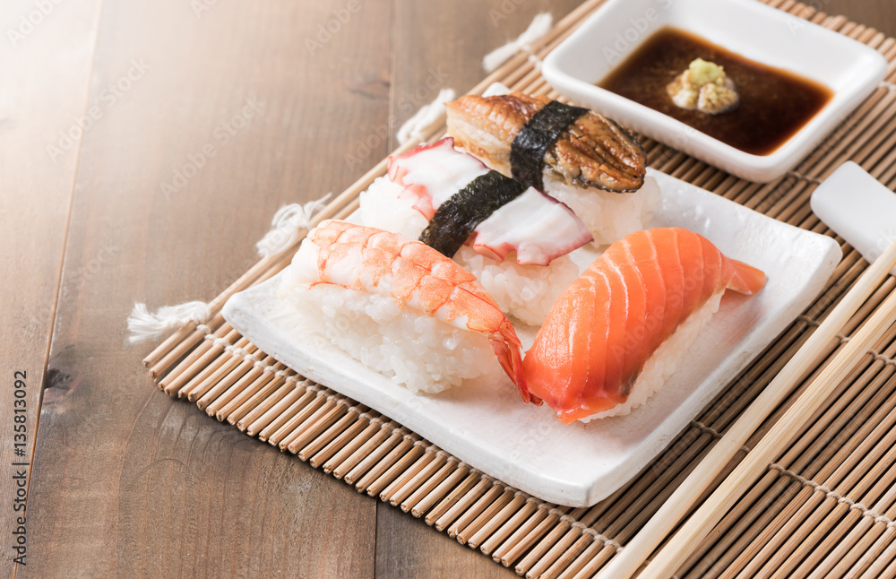 sushi with sauce and wasabi on wood plate sushi with sauce and wasabi on wood plate
