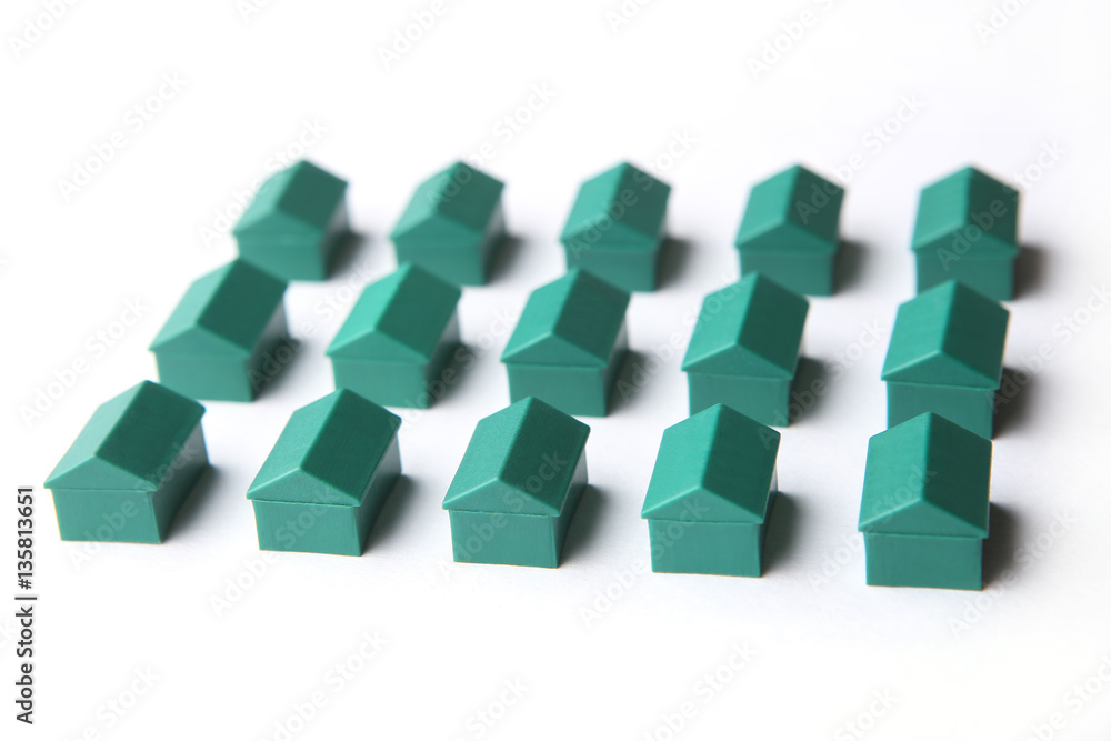 Plastic houses isolated on white background. Board game pieces. Plastic houses isolated on white background. Board game pieces.