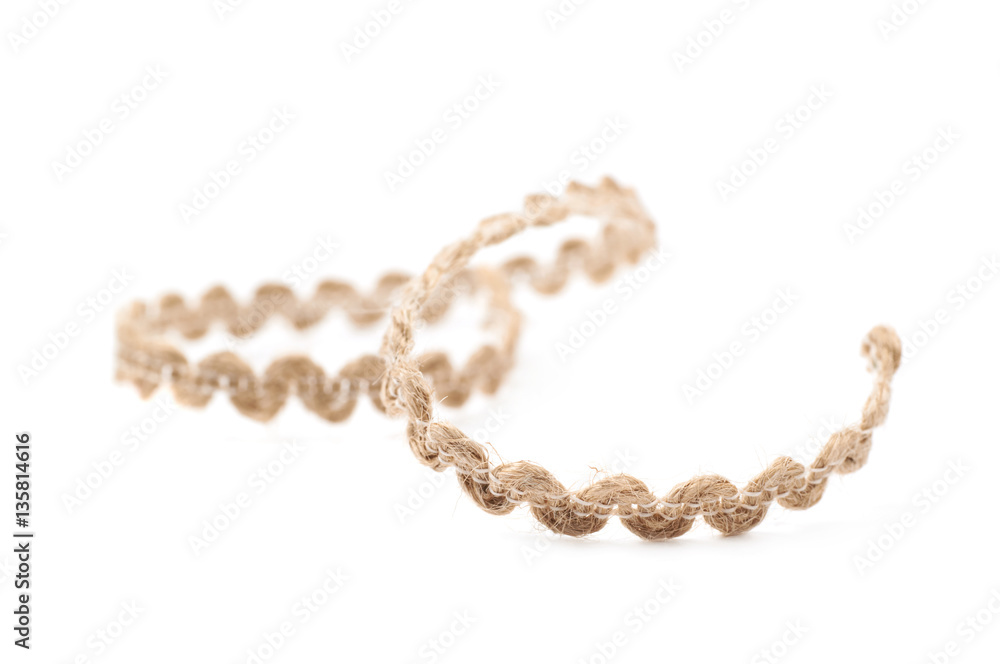 Fragment of a linen rope isolated Fragment of a linen rope isolated