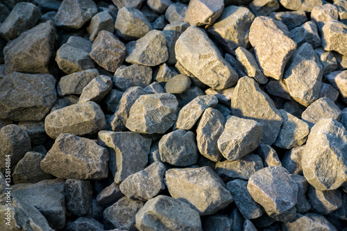 Crushed stone or angular rock is a form of construction aggregate, typically produced by mining a suitable rock deposit and breaking the removed rock down to the desired size using crushers.